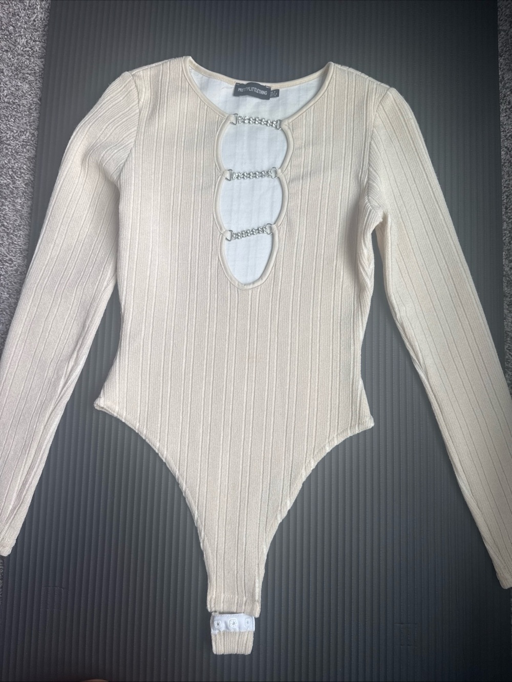 PrettyLittleThing Cream Ribbed Long Sleeve Chain Cutout Bodysuit